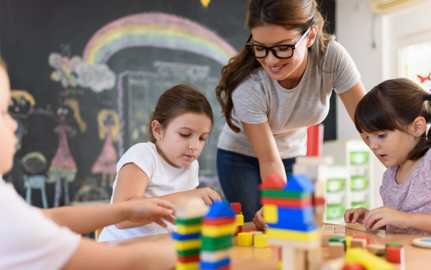 Child care educator with children