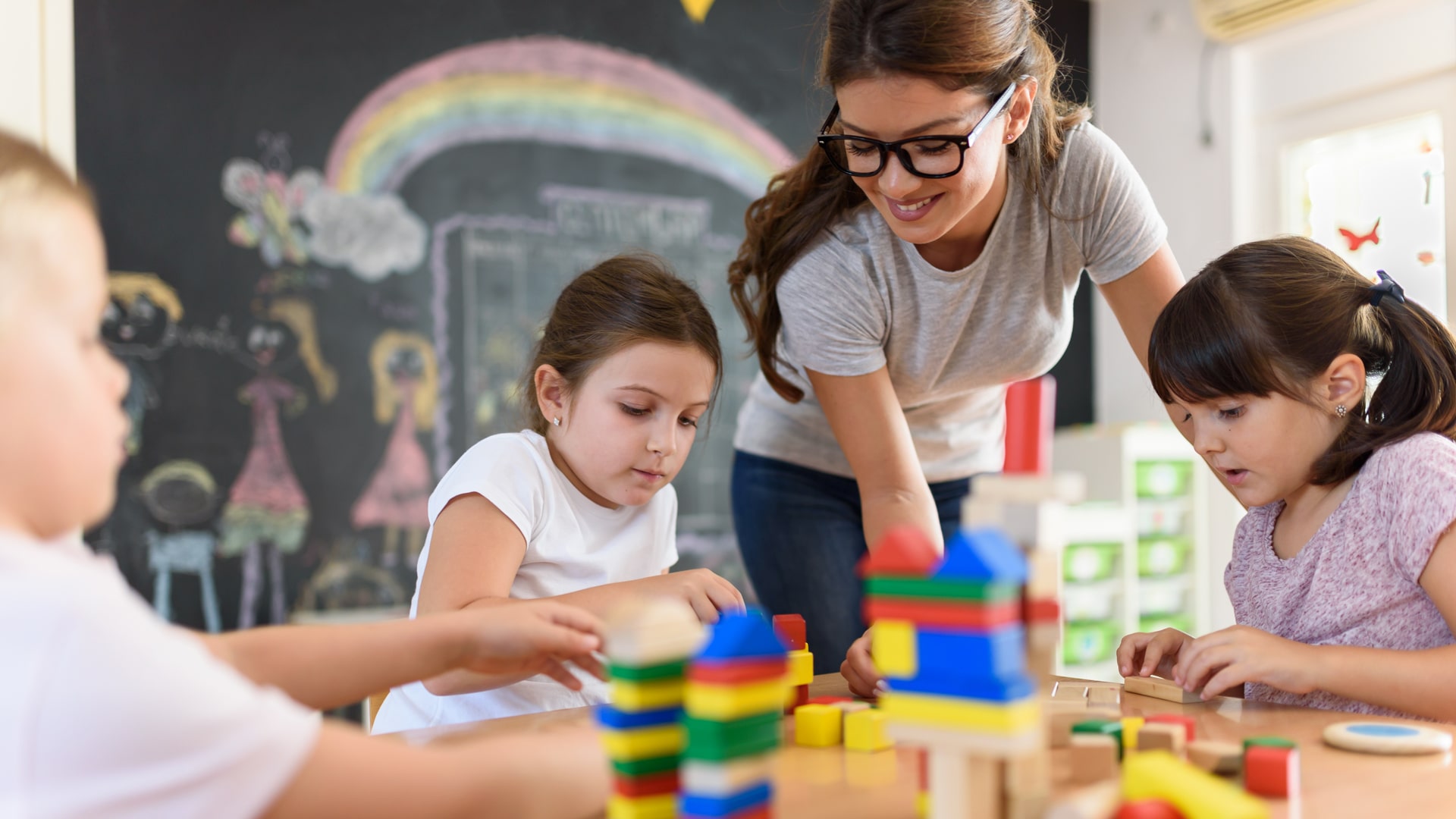 Child care educator with children