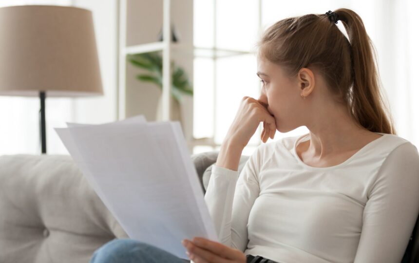 A woman reviews her student loan debt